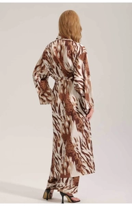 Back view of a long satin bathrobe featuring wild animal print and belted waist design