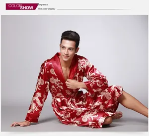 Detailed view of luxury men's wine red satin robe featuring golden dragon print and belt
