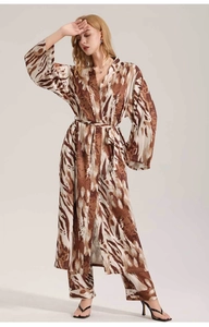 Detail view of leopard print satin loungewear set featuring long robe and trousers