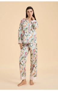 Detail of elegant floral long-sleeve pajama set with satin piping and tropical print