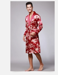Detailed view of men's red silk satin robe with golden dragon pattern and belted waist