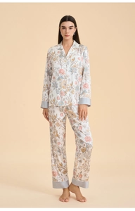 Close-up of floral pajama set with elegant lapel collar and satin trim detailing