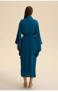Rear view of a long dark peacock blue satin robe with flowing sleeves and tie waist