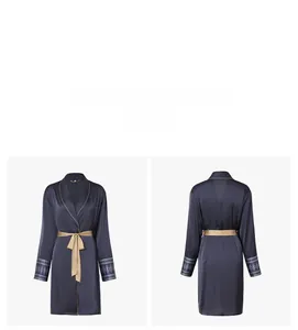 Front and back view of navy blue satin robe with gold trim and ethnic pattern cuffs