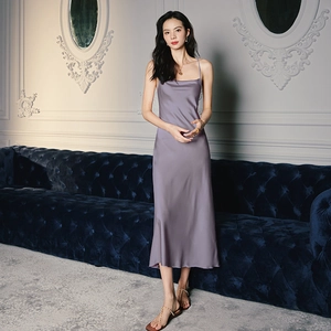 Close-up of elegant purple satin nightdress showing smooth silk texture and drape