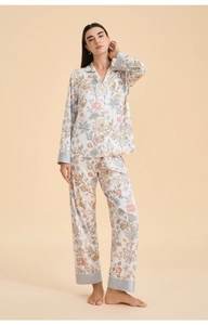 Detail of elegant floral pajama set featuring a notch collar and grey contrast trim