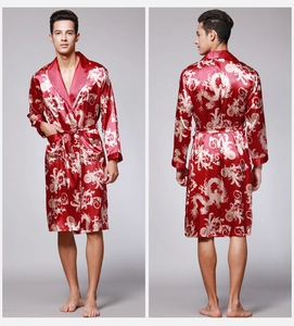 Detail of red silk robe with gold dragon patterns and shawl collar showing front and back