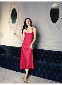Elegant red satin midi slip dress with thin straps and glossy silk-like finish