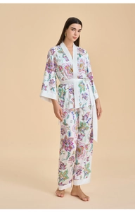 Detailed view of floral satin pajama set with kimono style wrap top and matching trousers