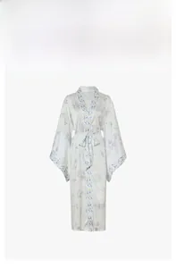 Detail of white satin kimono robe with blue floral patterns and flowing wide sleeves