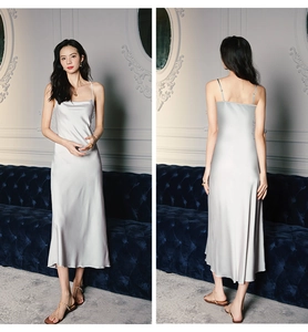 Detail view of silver satin spaghetti strap nightgown with elegant drape and silky texture