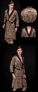 Detail of luxury paisley silk bathrobe showing contrast shawl collar and smooth satin texture