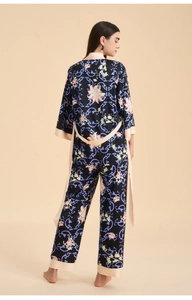 Detailed back view of premium floral satin pajama set with elegant cream trim accents