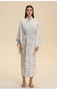 Close-up of floral kimono robe with blue patterned borders and decorative waist tie belt