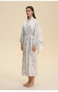 Detail of floral print satin kimono robe with delicate vintage geometric border and V-neckline