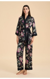 Detail of luxury floral paisley satin pajama set with tie-front wrap top and wide-leg pants