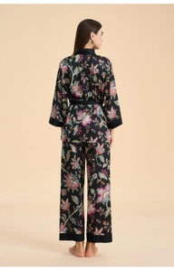 Rear view of floral satin loungewear set featuring long sleeve cardigan and straight pants