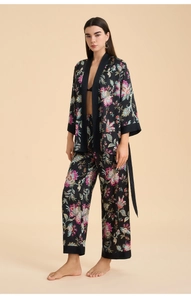 Detailed close-up of floral satin loungewear set featuring kimono robe and wide-leg pants