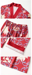 Close-up of red floral satin pajamas showing premium stitching and elastic waistband details
