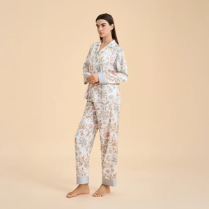 Elegant long-sleeved floral pajama set for women featuring lapel top and light blue trim