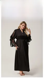 Close-up of black satin robe featuring elegant lace sleeves and a delicate ribbon bow