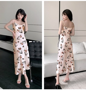 Detail of champagne satin slip dress with red tulip floral print and smooth silk texture
