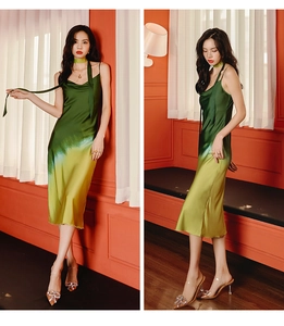Detail of green and yellow gradient satin midi dress with stylish neck scarf accessory