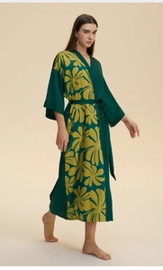 Detail of green floral satin kimono robe with loose sleeves and matching waist belt