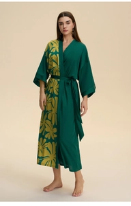 Detail of V-neck kimono robe with deep green and yellow floral print and waist belt