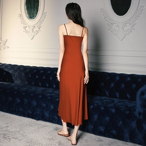 Satin slip nightgown in rust red with spaghetti straps and elegant drape back