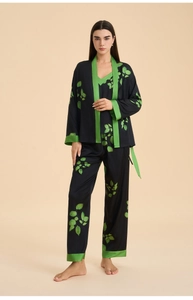 Detailed view of women's 3-piece satin sleepwear set with green leaf print on black fabric