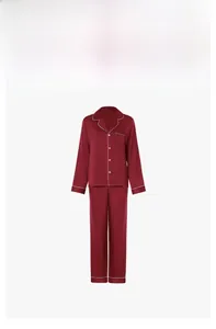 Detail of wine red satin pajama set with long sleeves and white piping trim