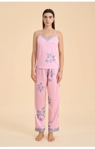 Detailed view of women's silk satin lounge set with V-neck camisole and patterned trousers