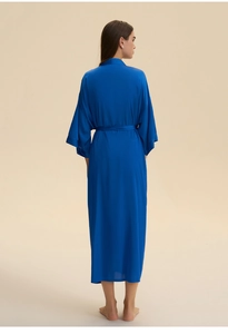 Rear view of long dark blue satin kimono robe with waist tie and smooth drapery