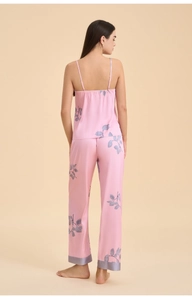 Back view of pink floral satin sleepwear set showing tank top and long pants detail
