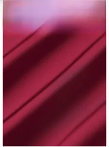 Macro shot of burgundy satin pajamas fabric featuring fine pleated textures and soft sheen