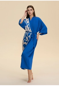 Detail of the navy blue satin kimono robe with artistic leaf patterns and silk waist tie