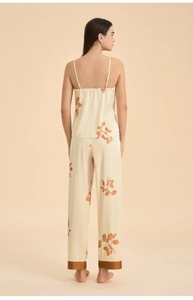 Detailed back view of women's floral satin pajama set with elegant branch pattern