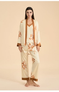 Detail view of premium satin three-piece sleepwear set with floral print and silk texture