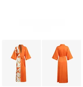 Front and back view of long orange satin kimono robe with white feather print detail