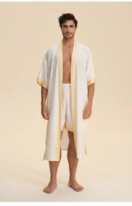 Detailed close-up of textured cotton-linen robe with mandala embroidery on the trim