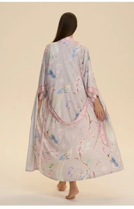 Detail of floral and bird print on back of long silk-style kimono robe for women