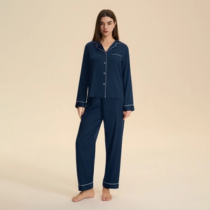 Navy blue satin pajamas set for women with long sleeves and elegant white piping trim