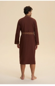 Detail view of the back of a chocolate brown long robe with vintage ethnic trim
