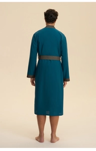 Detail view of the back of a teal men's long robe with geometric textured trim
