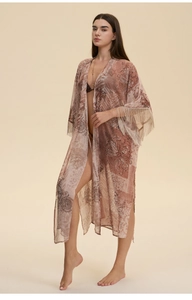 Detail of bohemian paisley chiffon cover-up featuring elegant tassel trim on the sleeves
