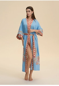 Detail of blue silk texture long pajama robe with elegant paisley patterns and belt