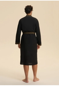 Rear view of black men's robe with gold geometric trim on collar and long sleeves