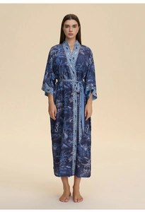 Close-up of deep blue floral kimono robe with silky texture and elegant belted waist