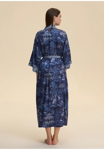Detail of navy silk kimono robe featuring intricate traditional landscape print and long sleeves